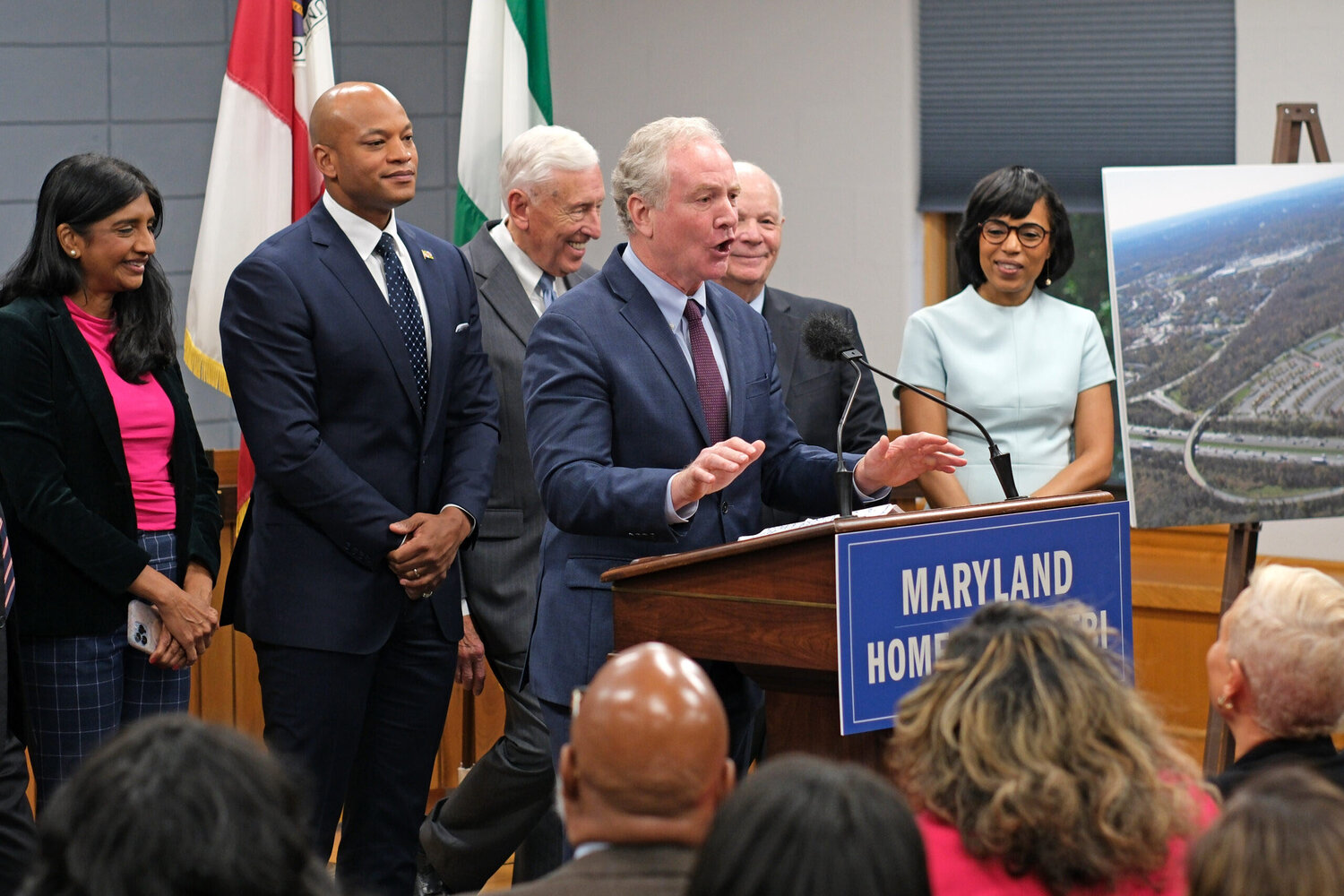 U.S. Sen. Chris Van Hollen defends the federal government's choice of Greenbelt, Maryland, for a new FBI headquarters Friday. He's joined by Maryland leaders, from left, Lt. Gov. Aruna Miller, Gov. Wes Moore, U.S. Rep. Steny Hoyer, U.S. Sen. Ben Cardin and Prince George's County Executive Angela Alsobrooks.