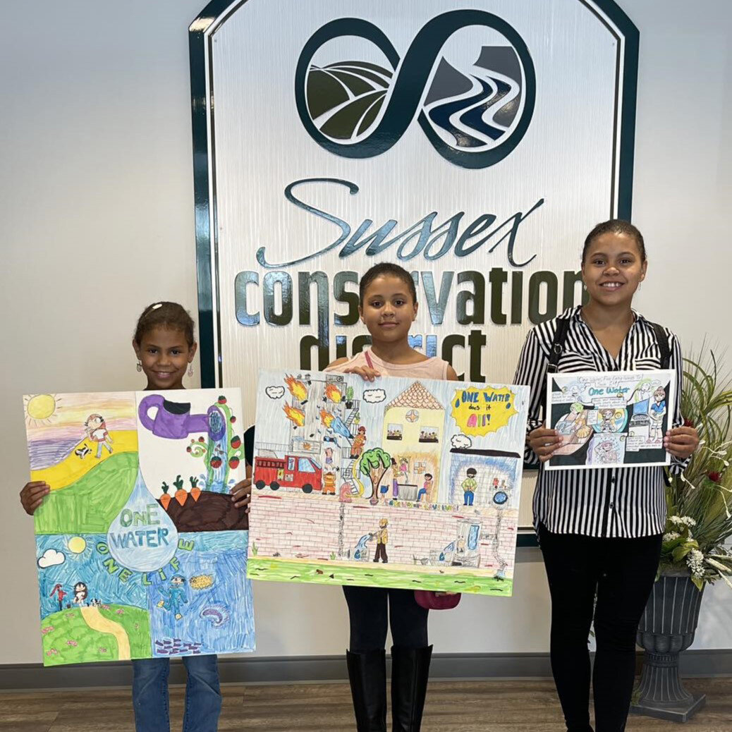 Four homeschooled students and Harbor Lights 4-H Club members from the Adams family of Milford placed in the 2023 Conservation Poster Contest. Pictured, from left, Claira Adams, third place in grade category 4-6; Rainna Adams, first place, and Linda Adams, third place in grade category 7-9. Not pictured, Briahna Adams, second place in grade category 7-9.