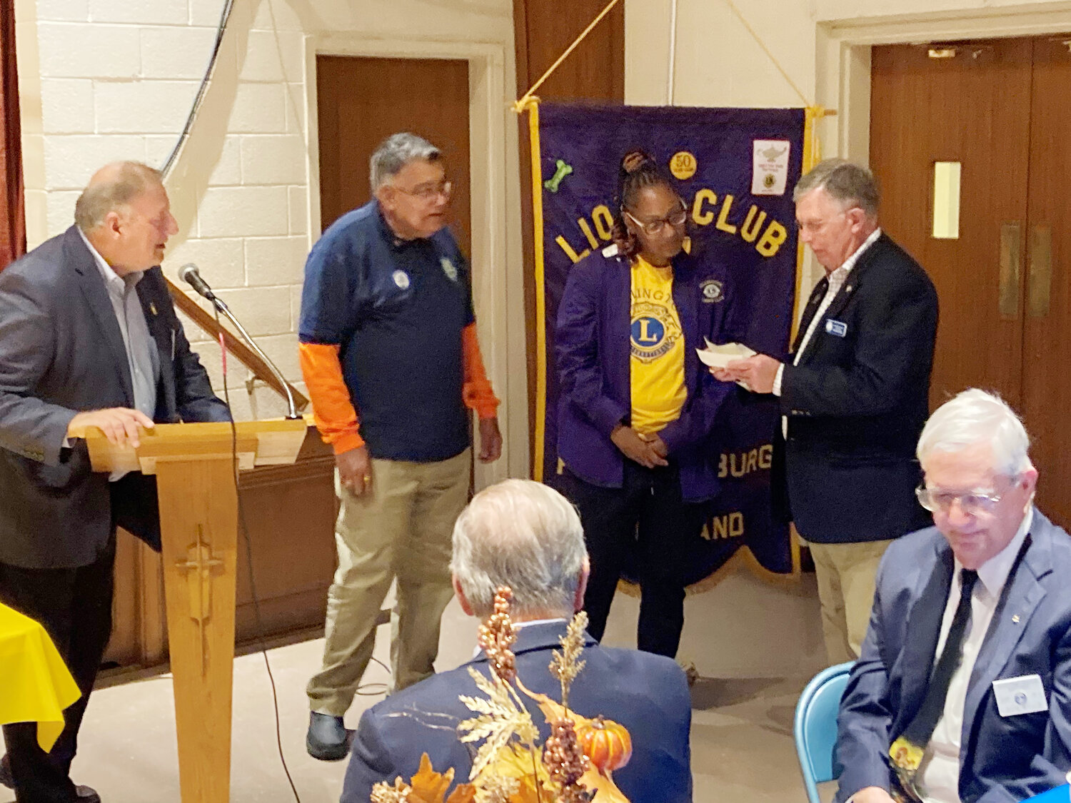 District 22B Zone Chairman Gene Williams presents donations from Cambridge, Easton and Trappe Lions clubs for Low Vision research at John Hopkins Wilmer Eye clinic. Clubs that attended this dinner raised $8800,which included Chestertown, Federalsburg, Preston, Millington, Sudlersville, Crisfield, Perryville and Elkton.