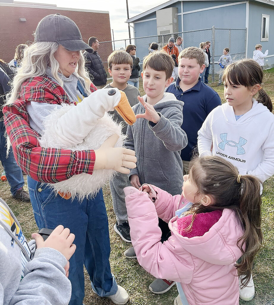Everyone knows about Turkey Trots, but what about a Wild Goose Chase? This has been an annual tradition at Warwick Elementary School since 2017, and this year was no exception. The tricky goose was everywhere, from chasing children approaching the finish line, to roosting on the roof, to making a few new friends among the Huskies. This year the runners in the Final of the Wild Goose Chase represented their class houses. The overall winners were Brooks Daniels and Aubrie Mills, both from the House of Altruismo. Kudos, too, to the several runners who gave up their own chances in the final to help a fellow student who fell.