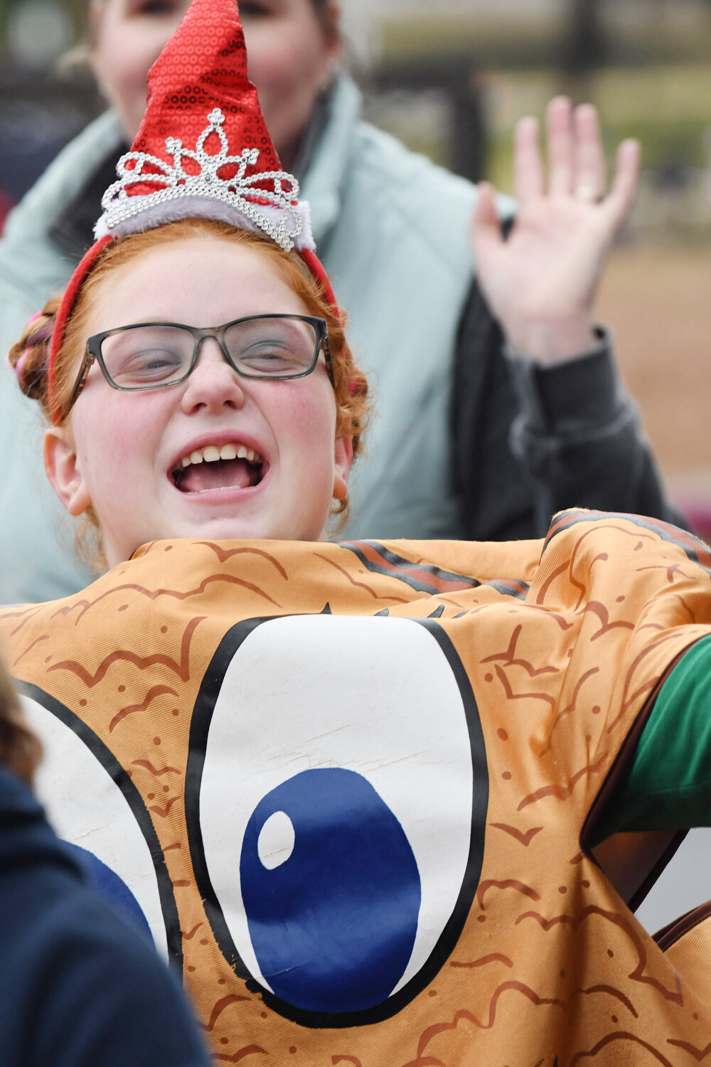 Ella Byrd, 9, of Salisbury, waves from her Girl Scout Troop 1059 and 101 of Salisbury cookie costume.