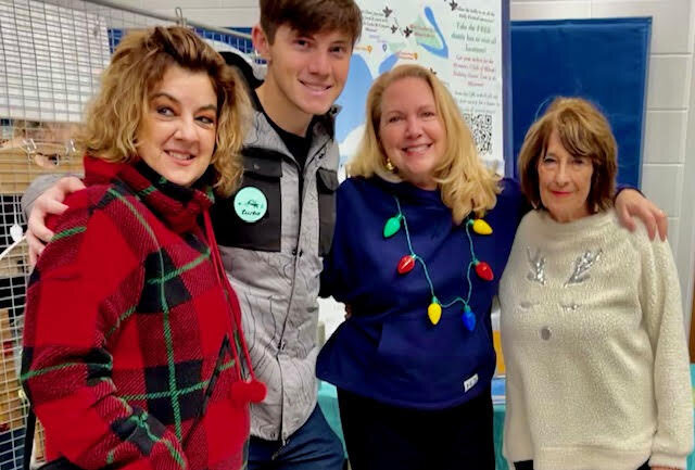 From left, Debbie Gaudip, Zack Gaudip from Milton Mail Boxes and Milton Chamber board member, Karen Falk, Milton Chamber executive director, and Kathy Clark, event co-chair and Milton Chamber board member at the 2022 Holly Festival.