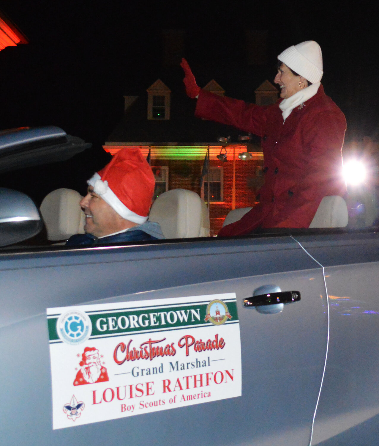Georgetown Christmas Parade grand marshal Louise Rathfon waves to the crowd Thursday.
