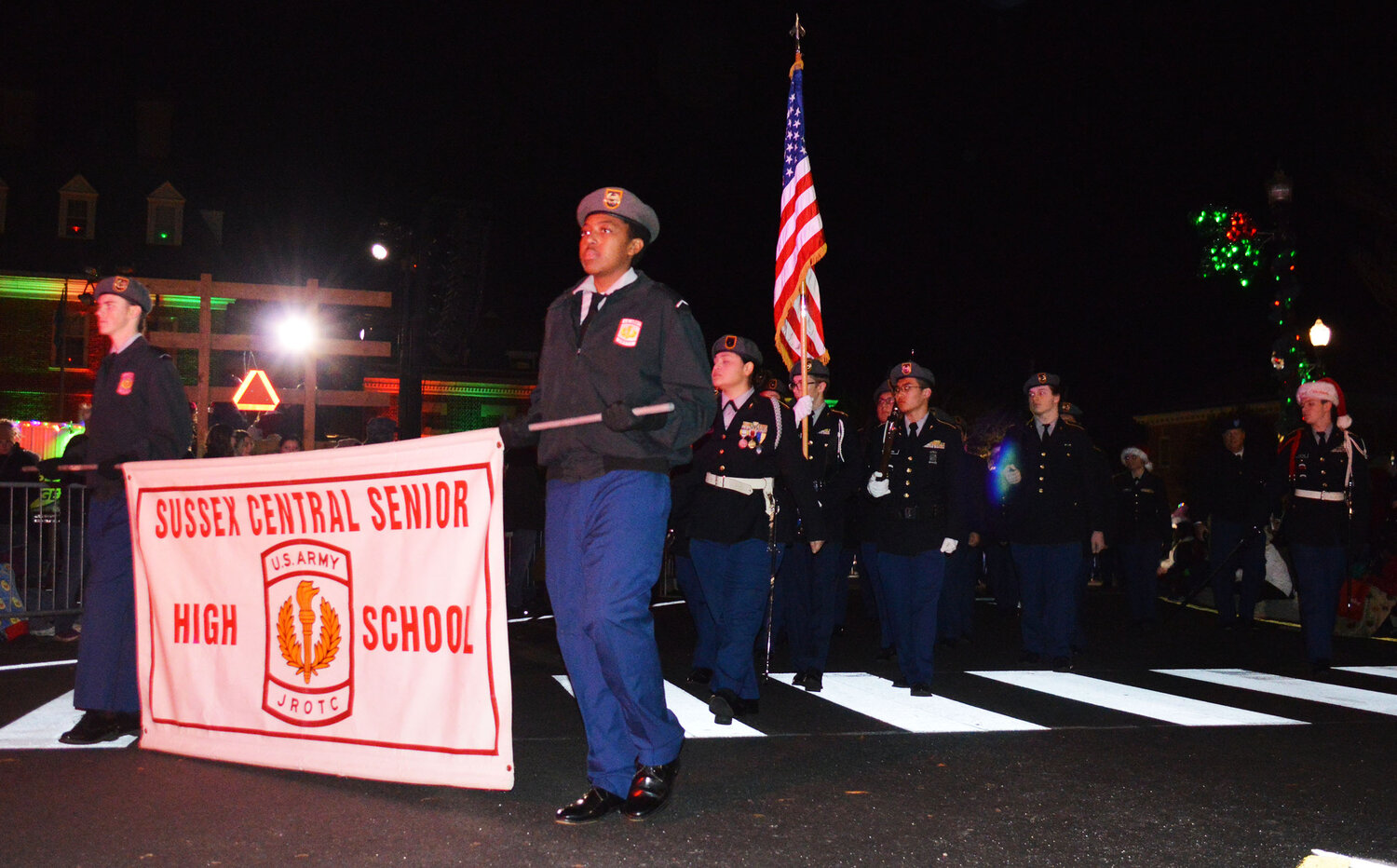 The Sussex Central High School Army Junior ROTC winds through The Circle during the Georgetown Christmas Parade on Thursday.
