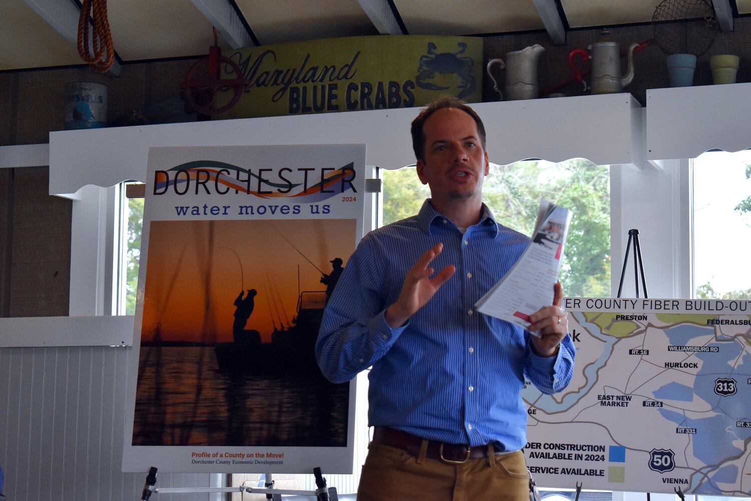 Publisher Konrad LaPrade welcomes the crowd to Dorchester Water Moves Us event in 2024.