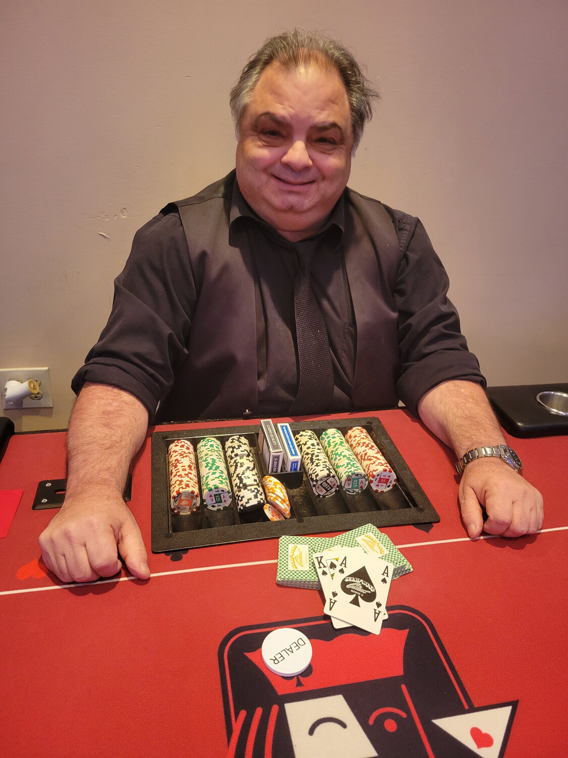 Poker dealer Rocco Maggi prepares for a game at the chamber gala Friday.