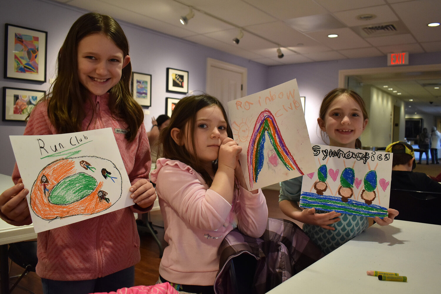 Running, rainbows and gymnastics: Tressa, Merida and Lenna Stant show the people and activities most important to them at the Biggs Museum of American Art.