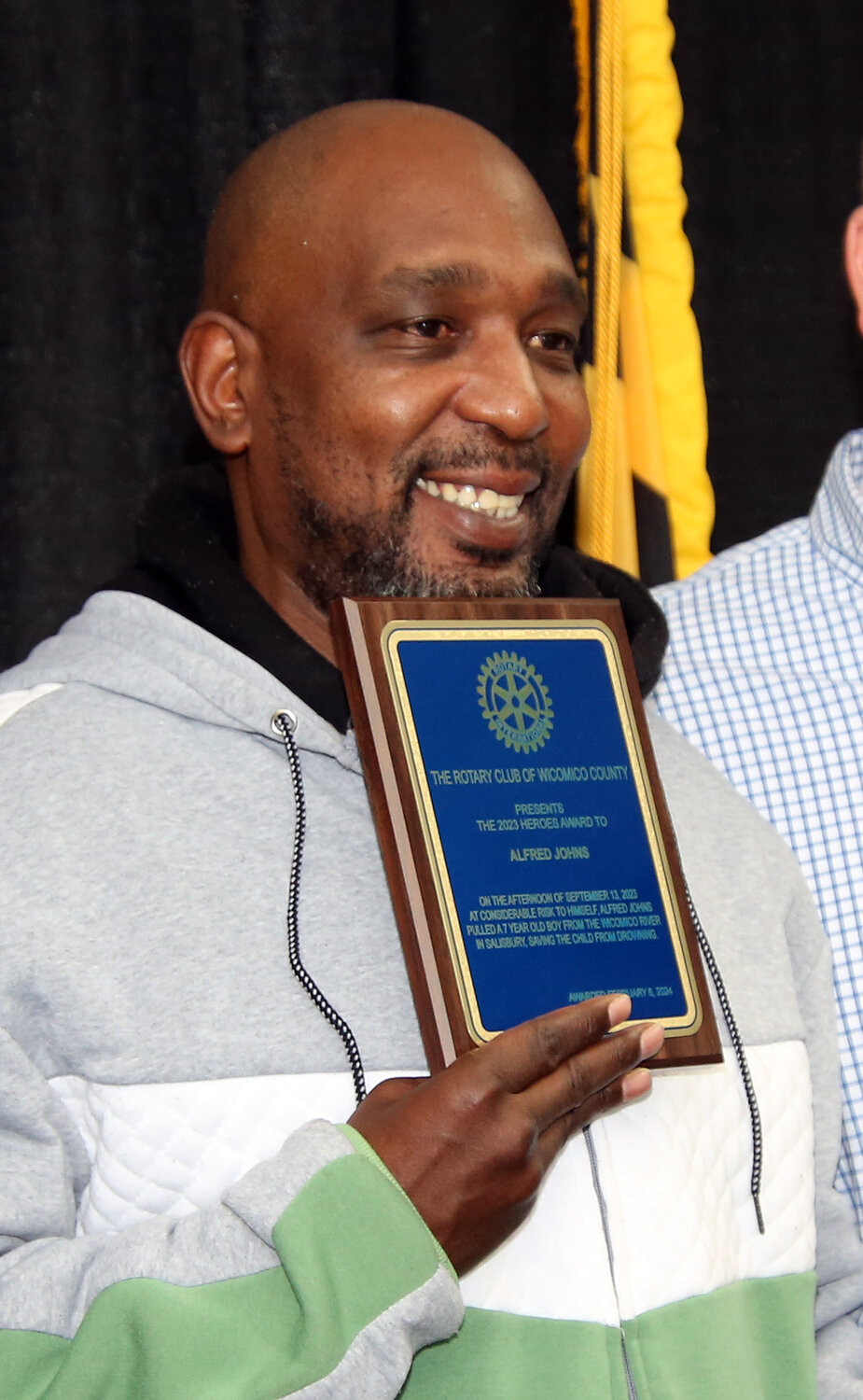 Alfred Johns show the plaque he received from the Rotary Club of Wicomico County. He was honored as a "Hero" for saving a 7-year-old boy who had fallen into the Wicomico River on Sept. 23 in Salisbury.