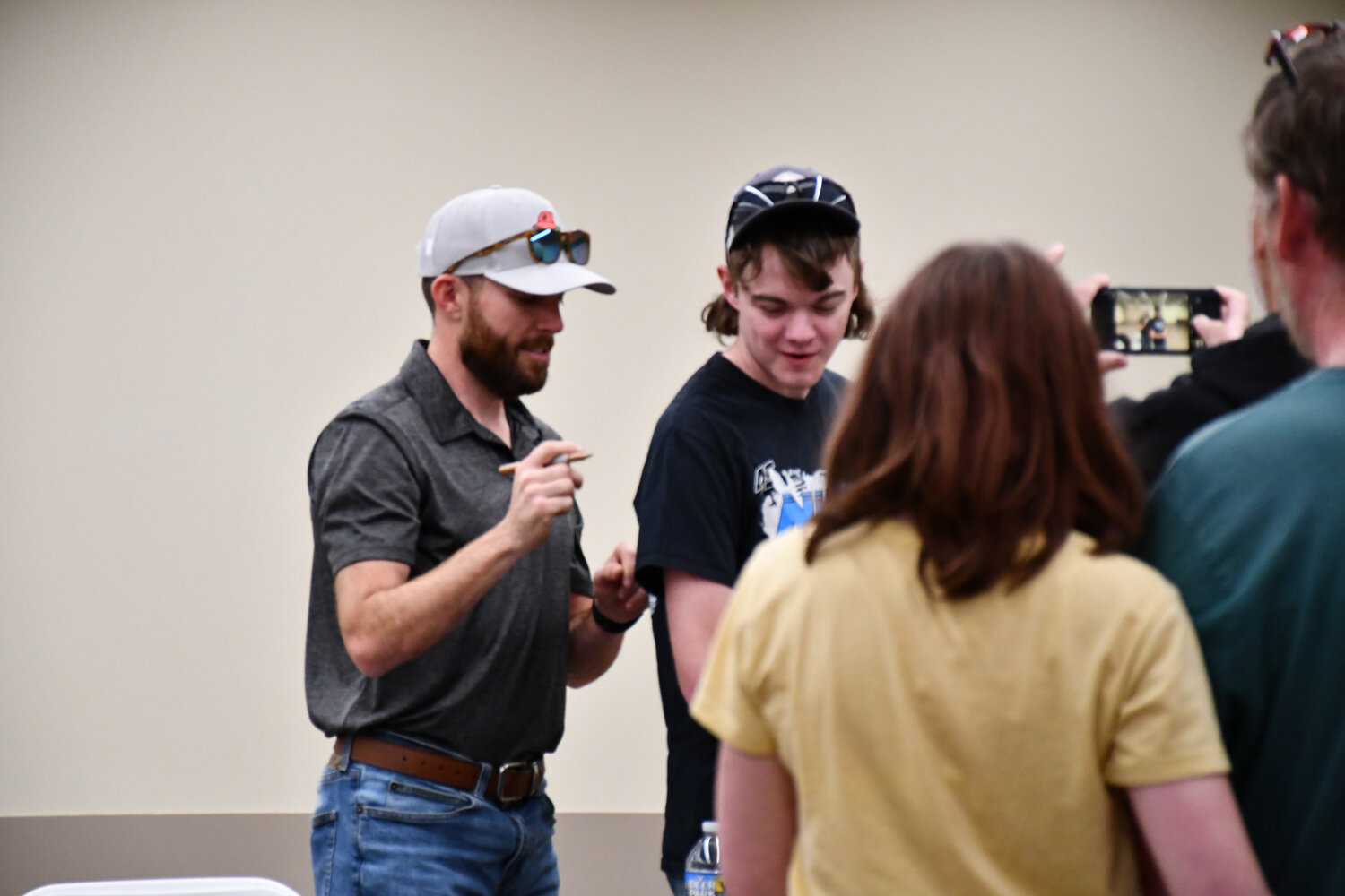 Ross Chastain, left, signed autographs for several fans Thursday at the Delaware Agricultural Museum and Village.