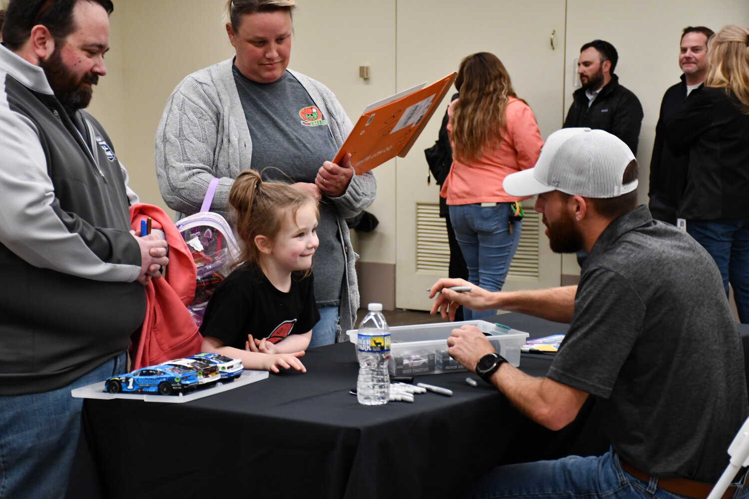 NASCAR fans were all smiles as Ross Chastain autographed their pieces Thursday.