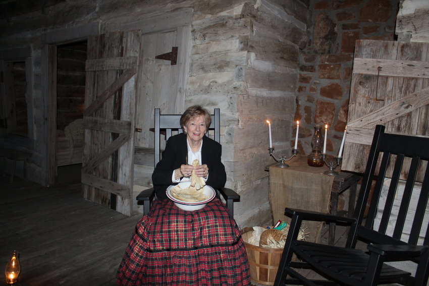 Vicki Frenzel waits to greet visitors to the &quot;Stars in the Village&quot; exhibit at Pioneer Village in 2019. The exhibit returns Saturday, Dec. 4, as well as Friday-Saturday, Dec. 10-11.