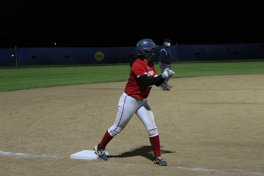 Kendall Amaya takes her lead off third base during Friday night&rsquo;s game against Gonzales. In addition to her work on the basepaths, Amaya pitched a complete game in the Lady Mustangs&rsquo; 21-8 win.