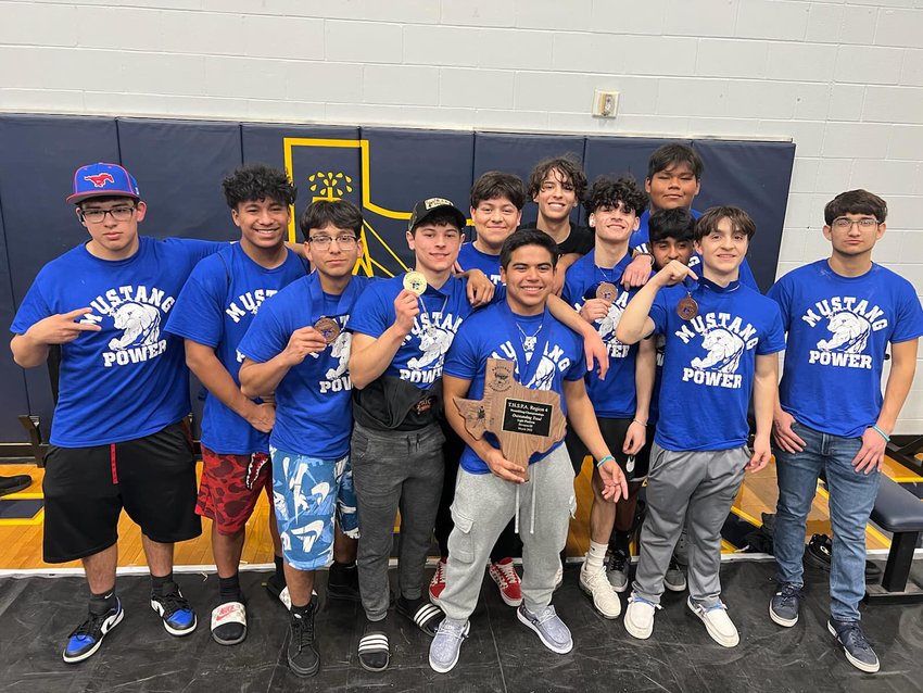 Members of the Nixon-Smiley Mustang powerlifting team celebrate their fifth place finish at the regional meet.