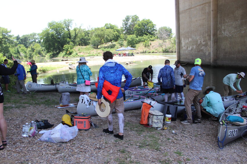 Paddlers rested under the Texas 183 bridge in Gonzales as they traveled the Guadalupe River for the 59th annual Texas Water Safari in 2022. This year&rsquo;s race starts Saturday, June 10, in San Marcos and ends Wednesday, June 14, in Seadrift.
