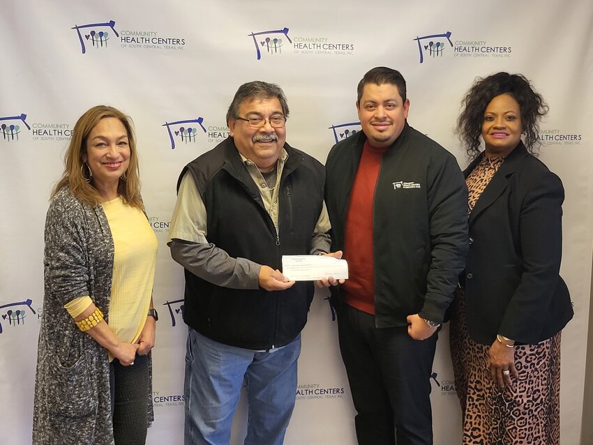 Carlos Camarillo (second from left), chairman of the Gonzales Elks Lodge No. 2314 Board of Directors, presents a $2,000 check to Debbie Marshall, Rafael De La Paz and Sharon Smith of the Community Health Centers of South Central Texas Inc. to help fund the organization&rsquo;s first community baby shower in Gonzales County.