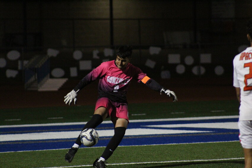 Apaches' goalie Andres Govea kicks the ball back into play in the district match against La Vernia Friday, March 8.