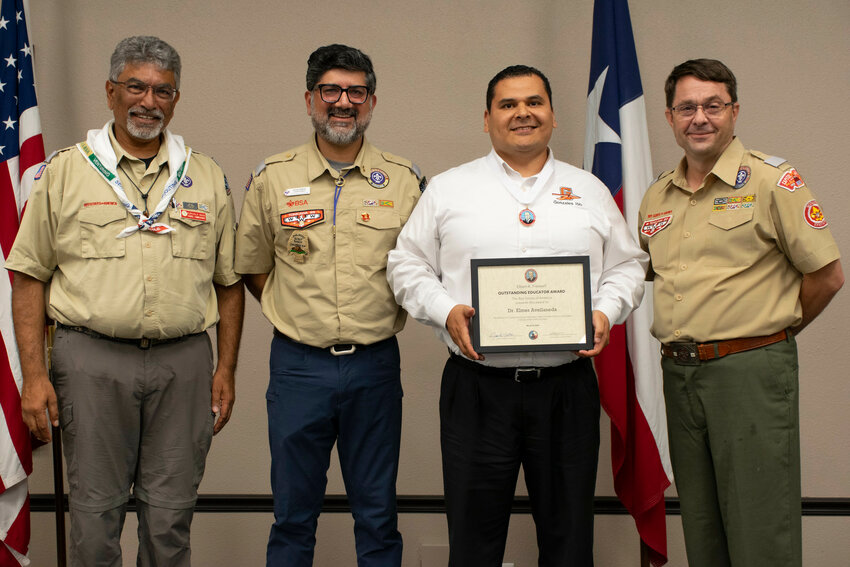 Dr. Elmer Avellenada, superintendent of Gonzales ISD, receives the Elbert K. Fretwell Outstanding Educator Award from the Boy Scouts of America.