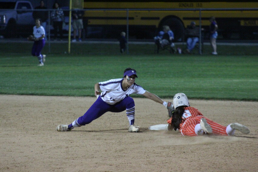 Lady Apaches freshman first baseman Alexis Hernandez (8) slides to second base in the district match against the Navarro Lady Panthers Friday, March 22.