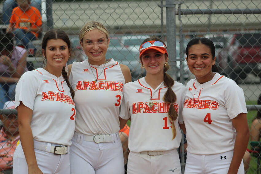 The Gonzales Lady Apaches celebrate the careers of seniors Kelly Breitschopf, Sydney McCray, Dakota Schmidt (15) and   Haley Cantu (4), who played their last home game against the San Antonio JFK Lady Rockets.