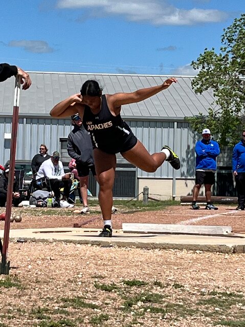 Lady Apaches senior Malory Clack throws in the shot put competition in the area meet at Canyon Lake High School Wednesday, April 10. Clack finished third in the shot put competition and clinched a spot in the regional meet in Kingsville.