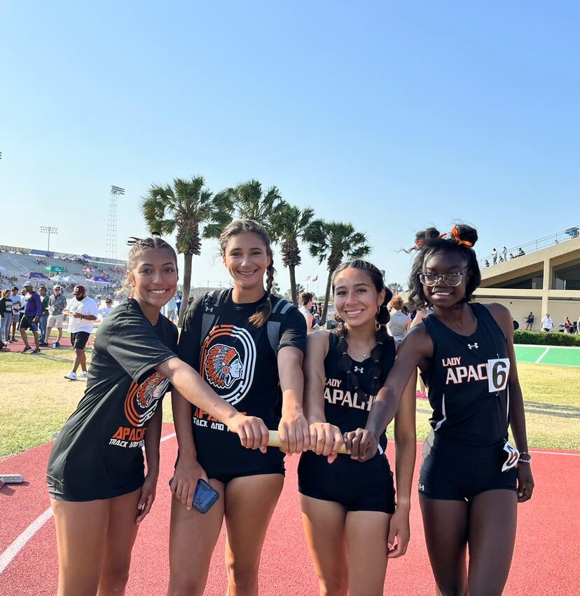 Kaylyn Gonzales, Jayda Glass, Macey Pena and Tiana Smith hold the baton for the 4x100 meter race at the regional meet.
