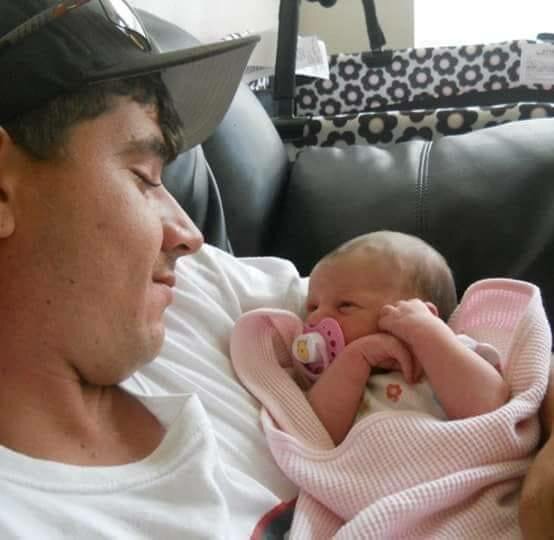 Brandon O'Quinn Rasberry holding his niece, Larissa, the daughter of his brother and sister-in-law, Jonathan and Emily Fojtik. Larissa is now 12, just a few years older than the boy who shot and killed her Uncle B.