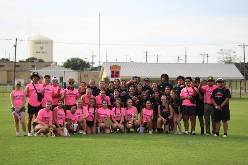 The Gonzales Apaches seniors (pink) and juniors (black) together of the annual Powder Puff Football game Wednesday, May 15 at Apache Field. The juniors swept the seniors in both volleyball and football games.