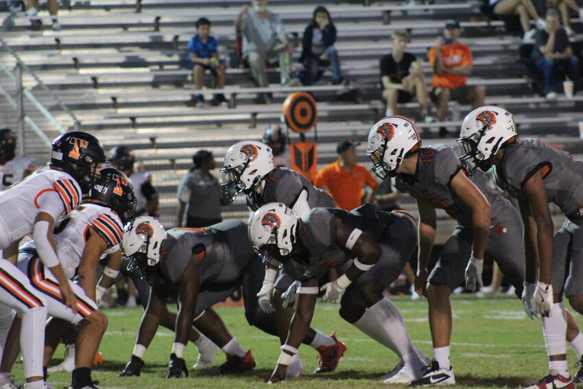 The Gonzales Apaches defensive line squares off against the Smithville offensive line in the district opener Friday, Oct. 4.