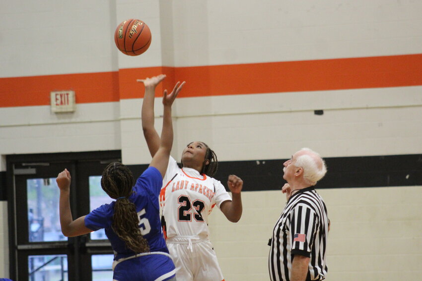 Lady Apaches junior Zniyah Washington (23) jumps in the air for the tipoff against the Lehman Lady Lobos Friday, Nov. 8.