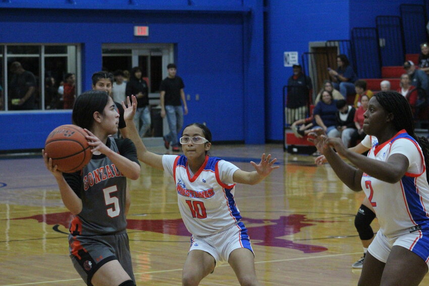 Lady Mustangs sophomore point guard Grace Gomez (10) and senior shooting guard Janaelyn White (2) defends Lady Apaches senior Kilee Schwausch (5) early this season.