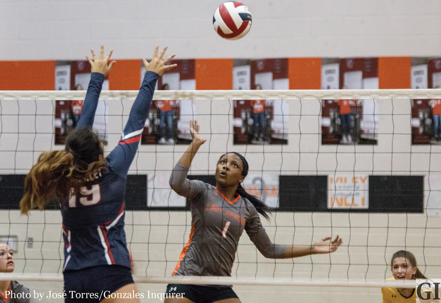 Chelsie Hastings (1) tries for a tip in the Lady Apaches’ three-set loss to Wimberley.
