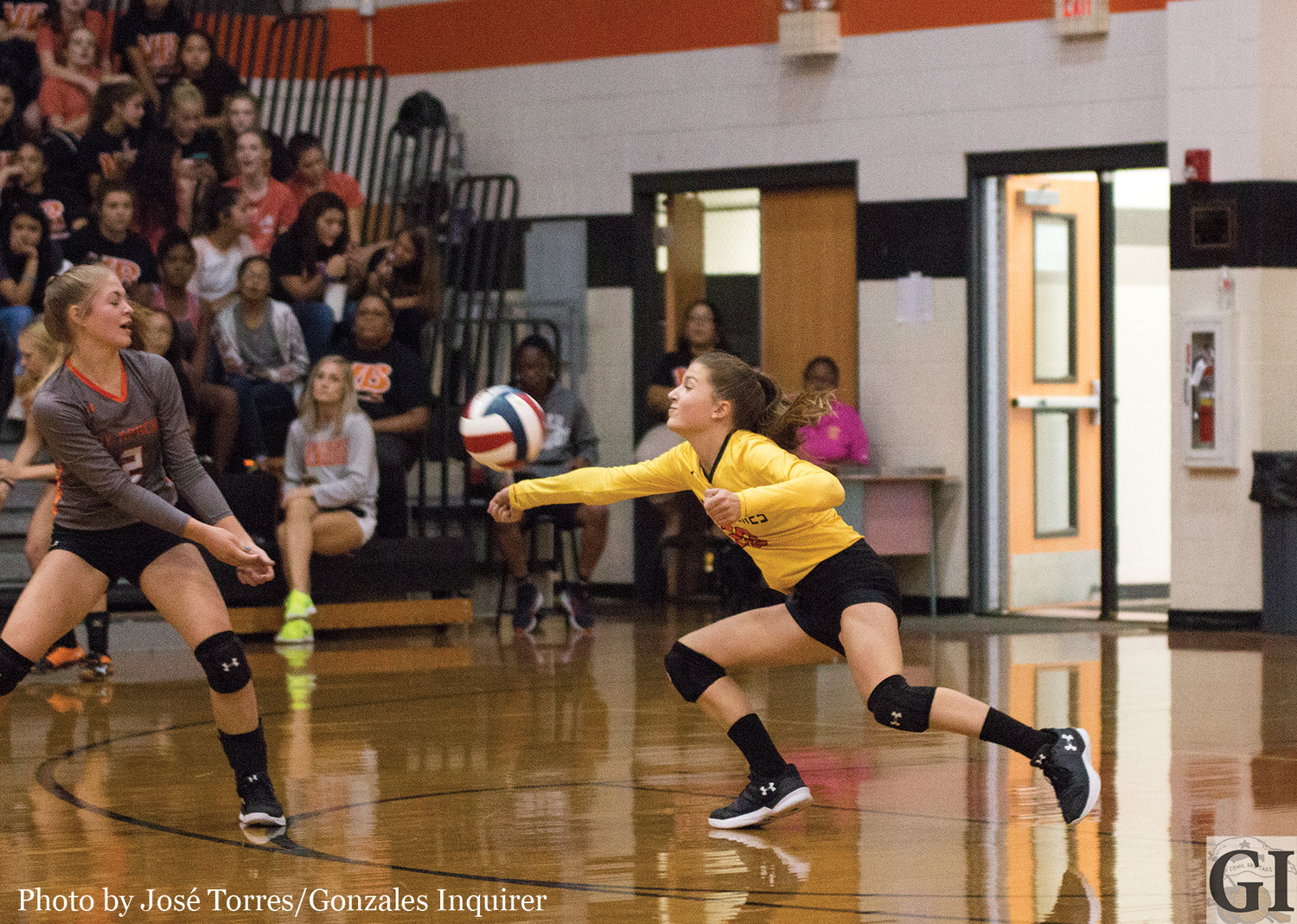 Sam Barnick (20) stretches out for a dig during a Gonzales three-set loss to Wimberley Tuesday night.