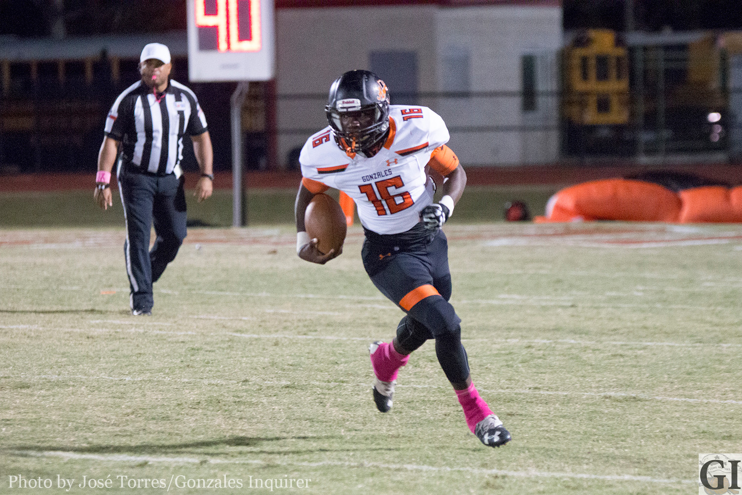 Sophomore back Elijah Holiday (16) carries the ball in Gonzales' 17-14 win.
