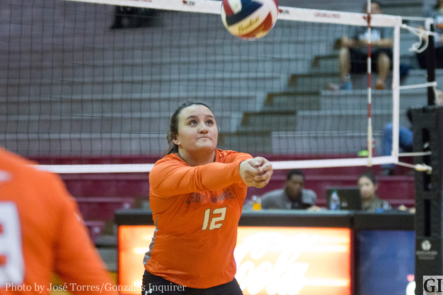 Alexandria Rocha (12) sets a ball during Gonzales’ three-set loss in the bi-district round against Fredericksburg.