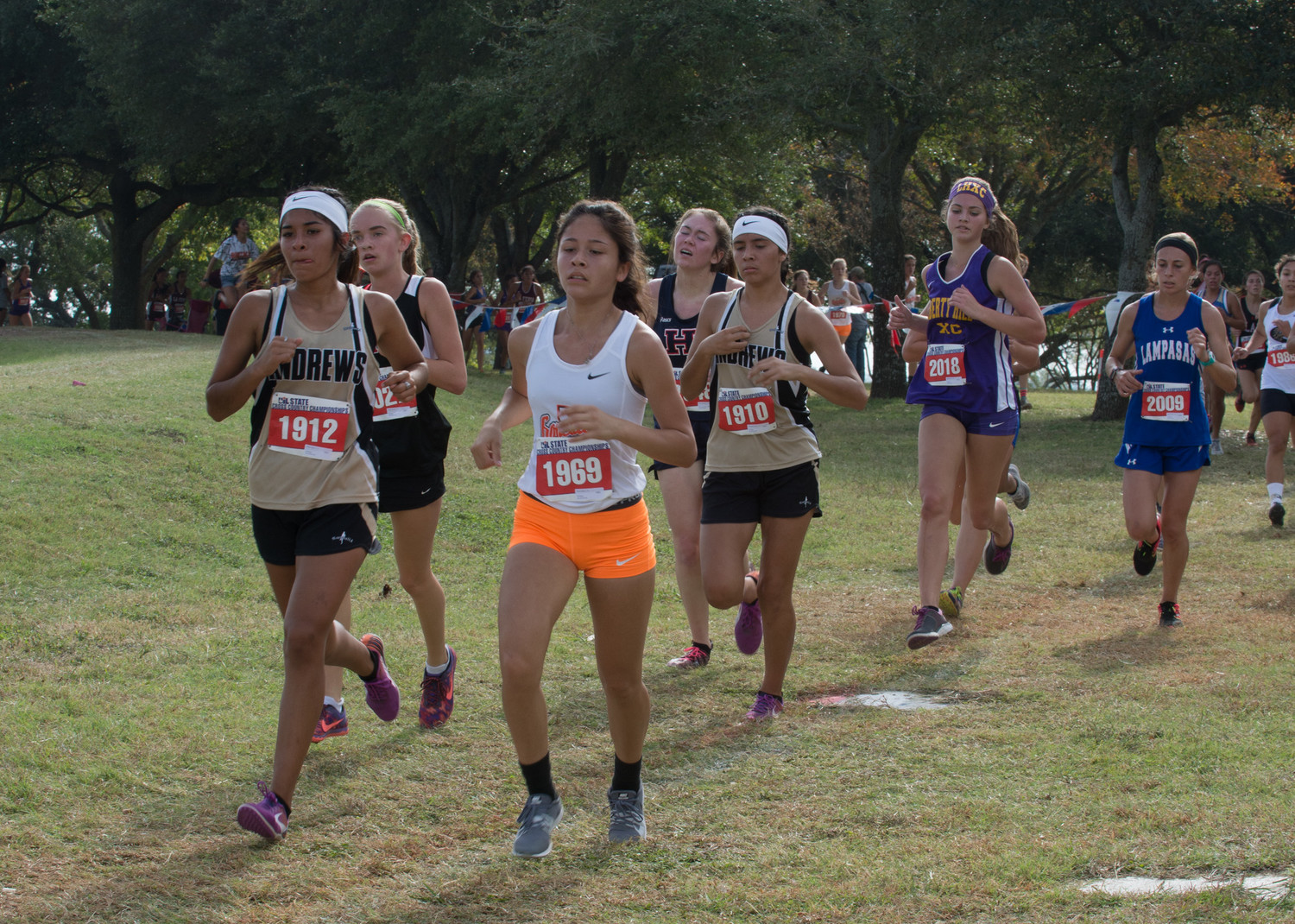 Senior Romy Cantu (#1969) finishes out her final cross-country meet as a Gonzales Lady Apache.