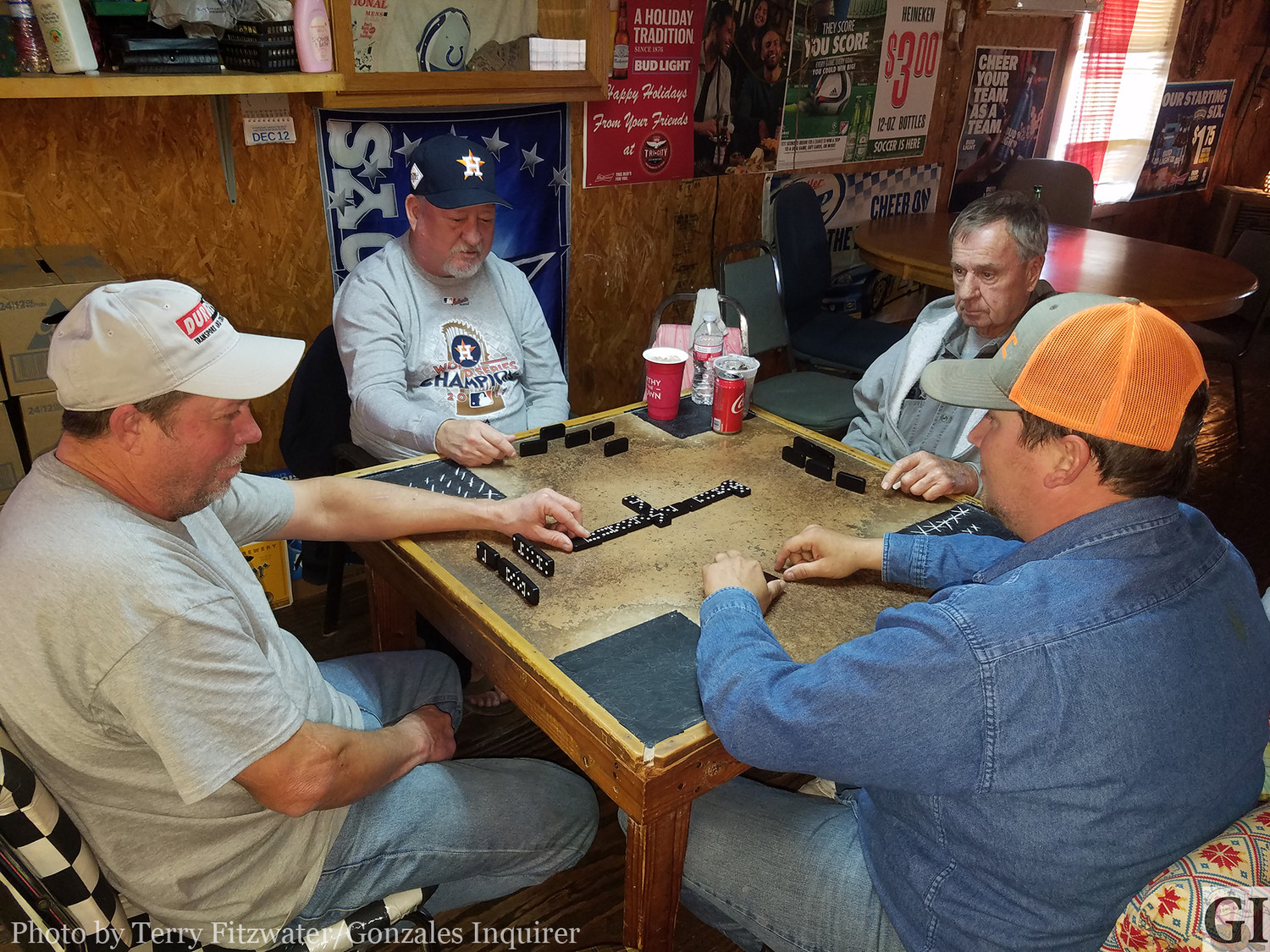 Patrons of Boomer’s Sports Bar come over for food, drinks, hospitality, and even some dominoes.