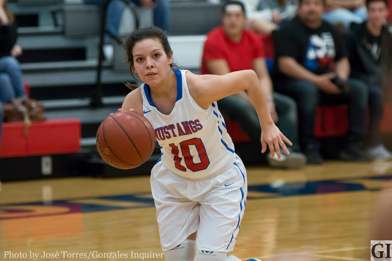 Maggie Mendez (10) drives to the basket.
