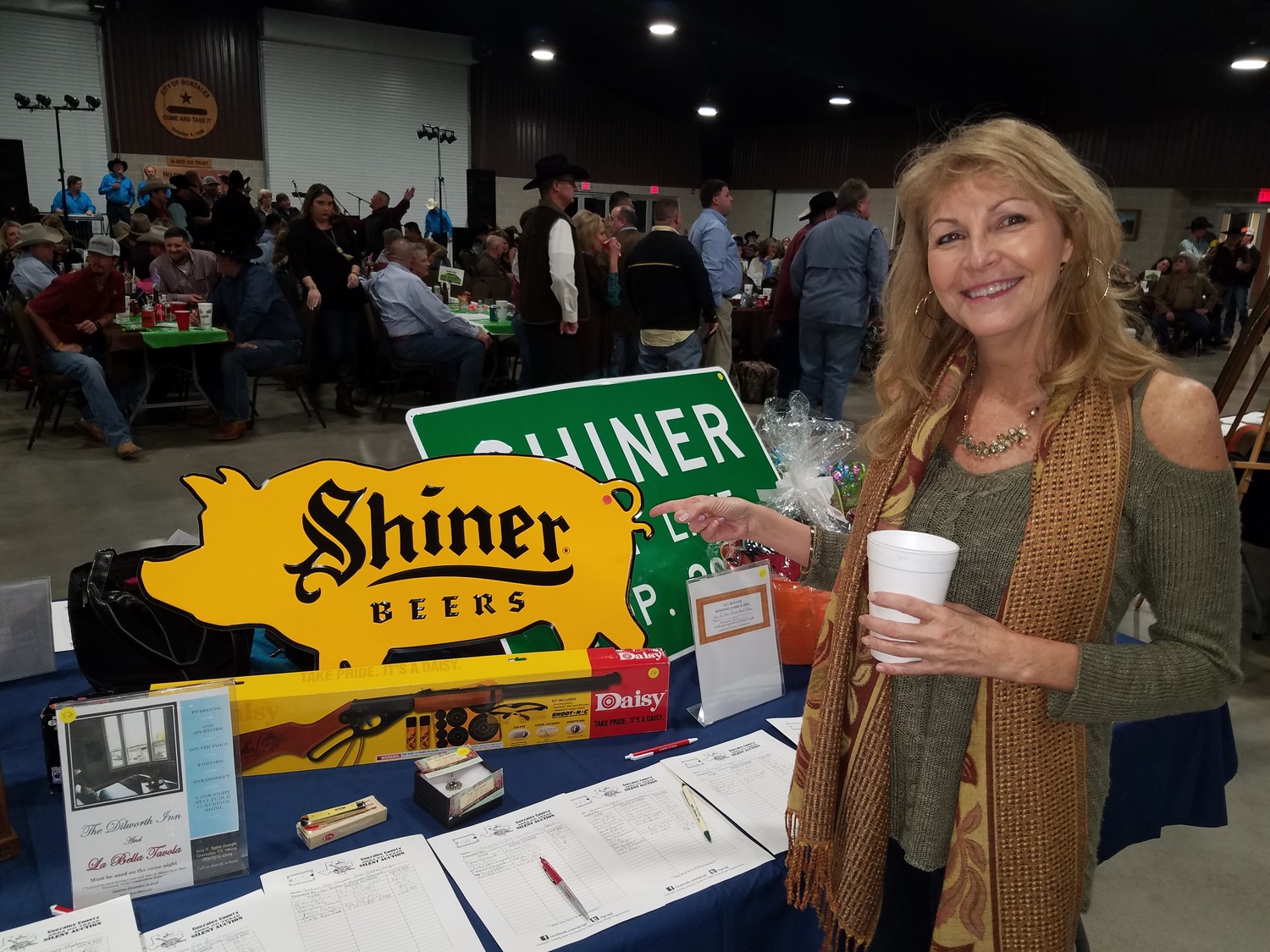 Donna Mayeaux had fun at the Go Texan fundraiser, as she set her eyes on the Shiner pig ornament.