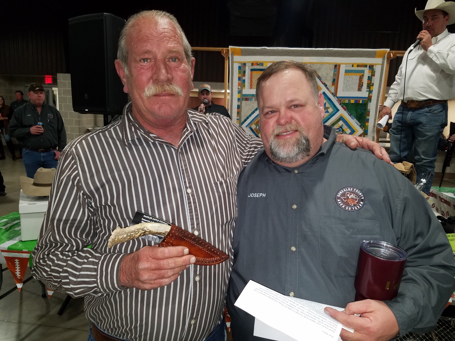 Gordon Brandenburg holds a knife he outbid everyone for during the live auction. The knife was named for Randale Eugene “Big Poochy” Kridler and made by Cary Hackler of Grimes County. After winning the bid for the knife, Brandenburg gave it to Kridler’s son, Joseph “Poochy” Kridler.