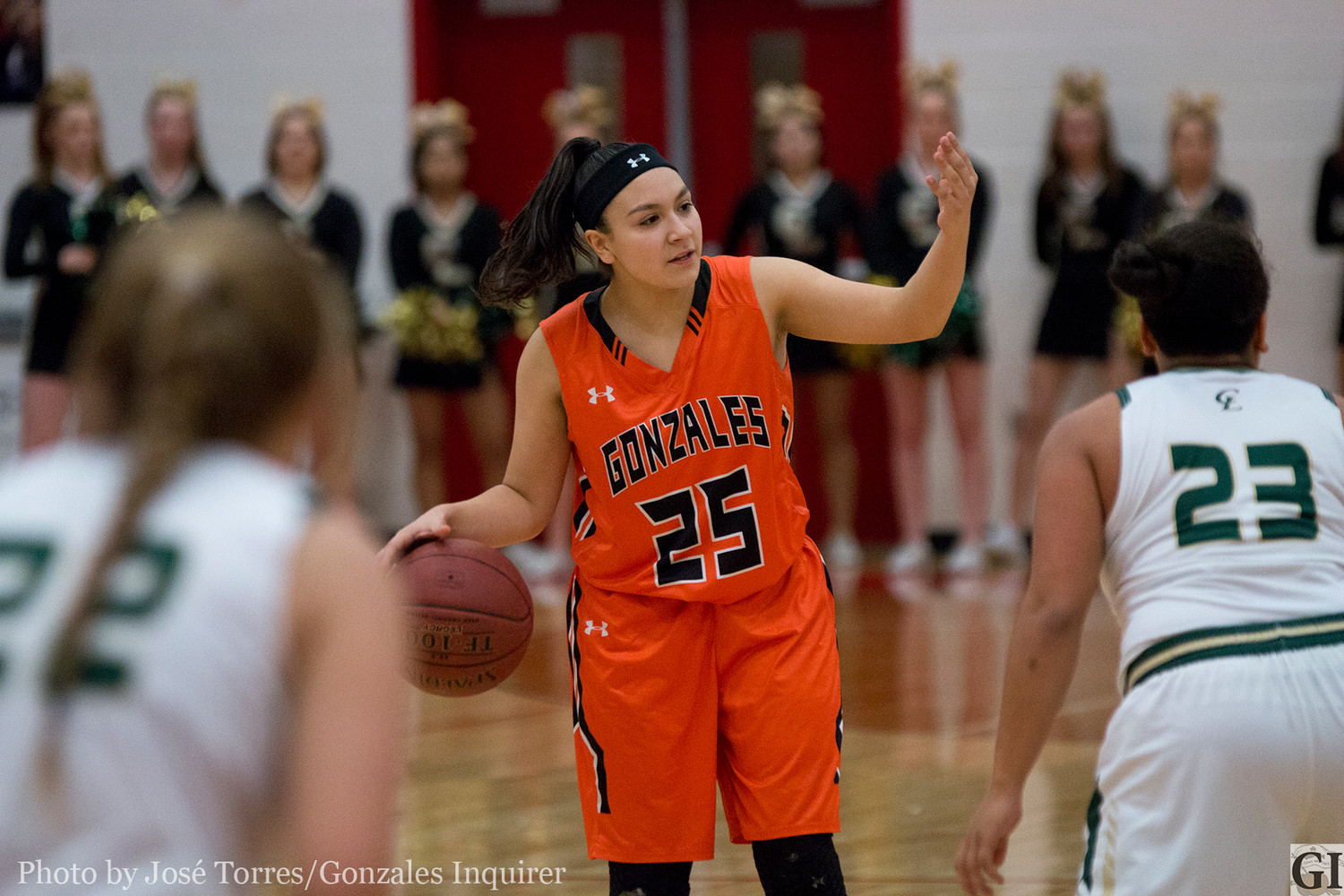 Chella Longoria (25) dribbles down the court in Gonzales’ 43-20 bi-district loss to Canyon Lake on Tuesday. Longoria led the team in scoring with seven points.