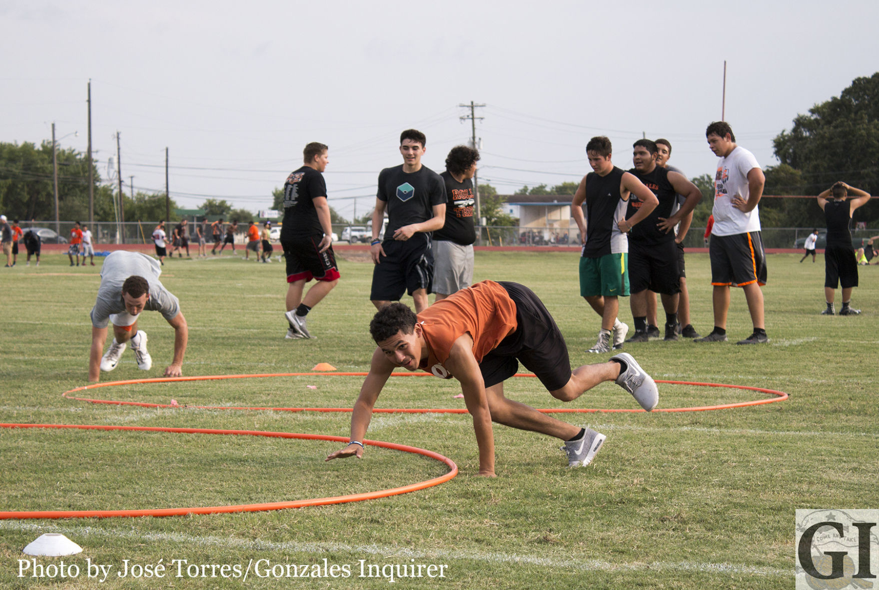 Gonzales athletes work through drills in the evening heat during voluntary summer workouts. Two-a-days begin Monday, with 10th-12th grade athletes expected at 6 a.m. and freshmen expected at 10 a.m.