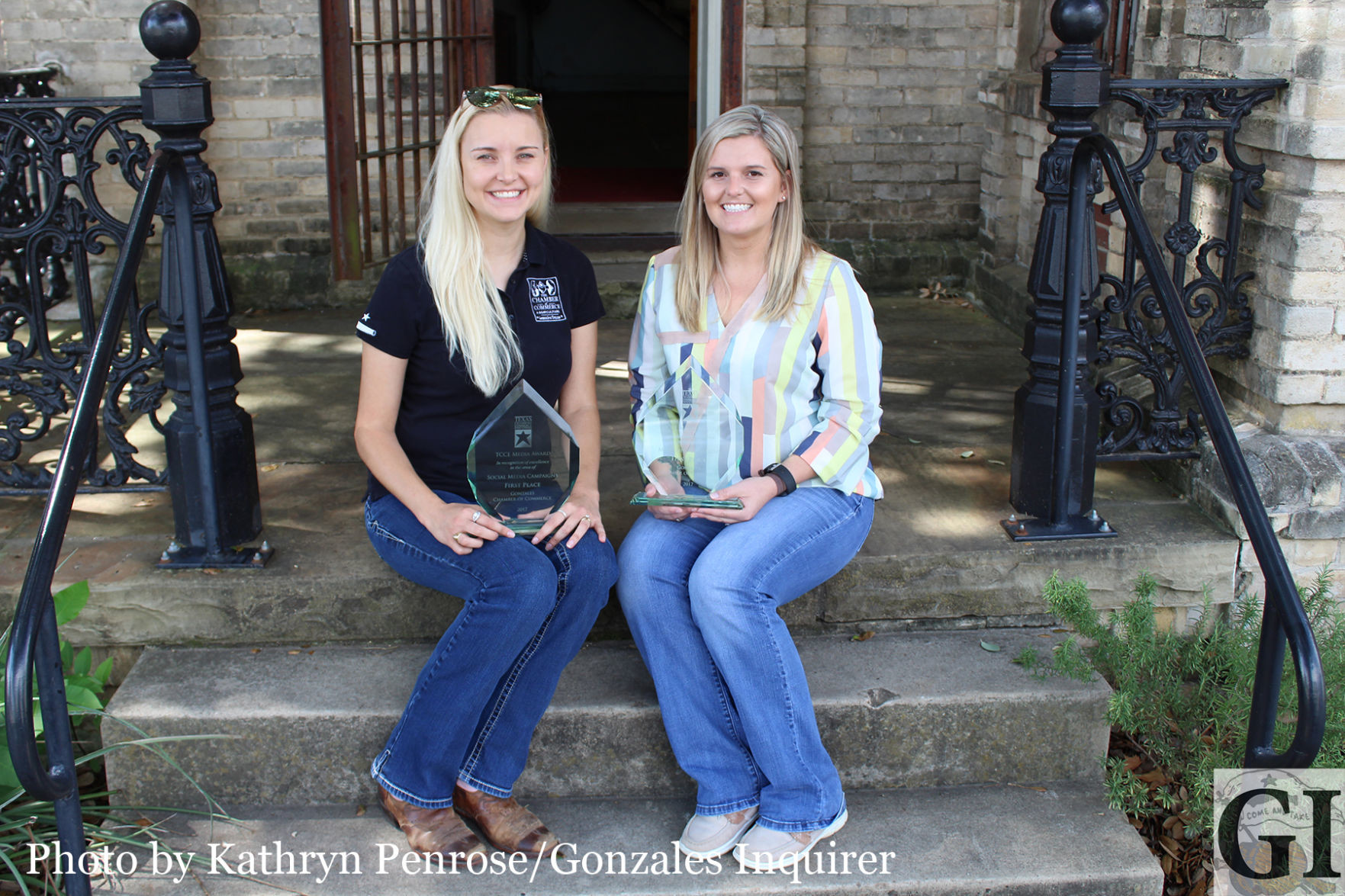 Gonzales Chamber of Commerce Executive Director Daisy Freeman-Freeman and Administrative Assistant Liz Riley with two of the chamber's recent awards.