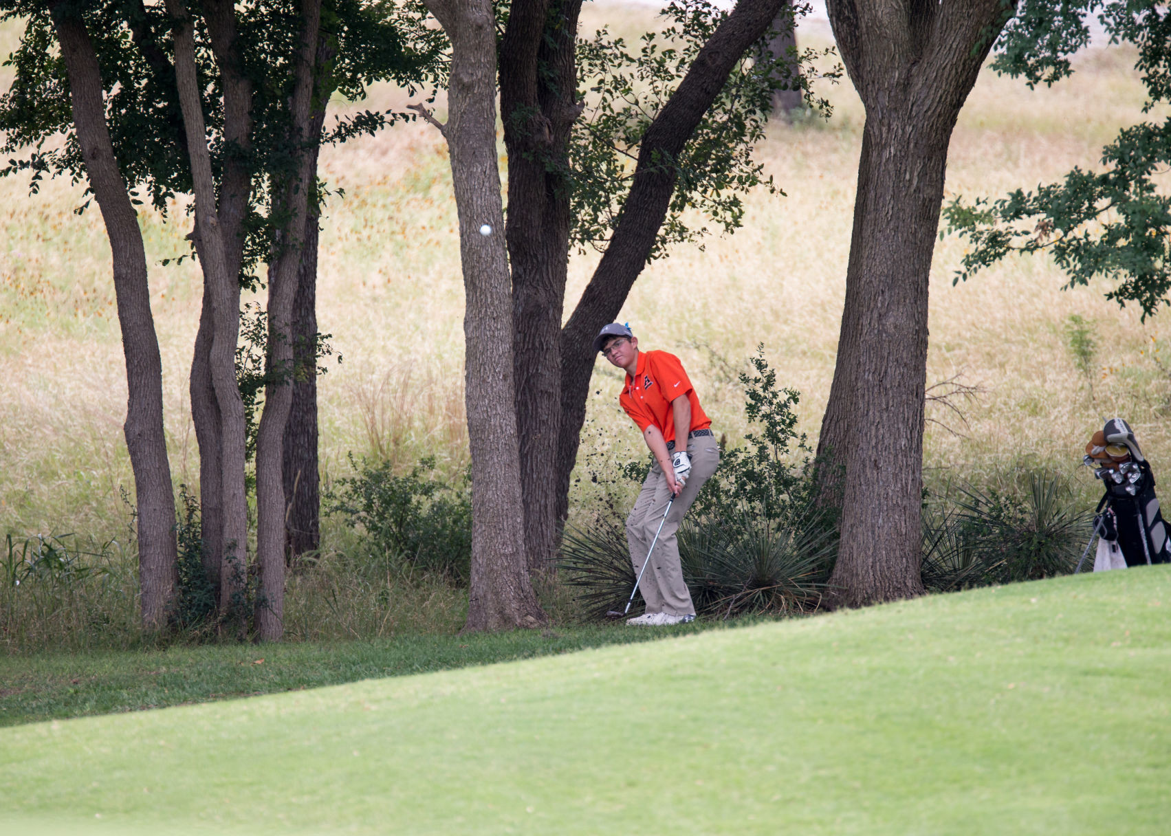 Gonzales High School's Mason Richter makes a shot from the rough during the opening round of the Class 4A boys state golf tournament at Apple Rock Golf Course in Horseshoe Bay, Texas, on Monday, May 22, 2017.