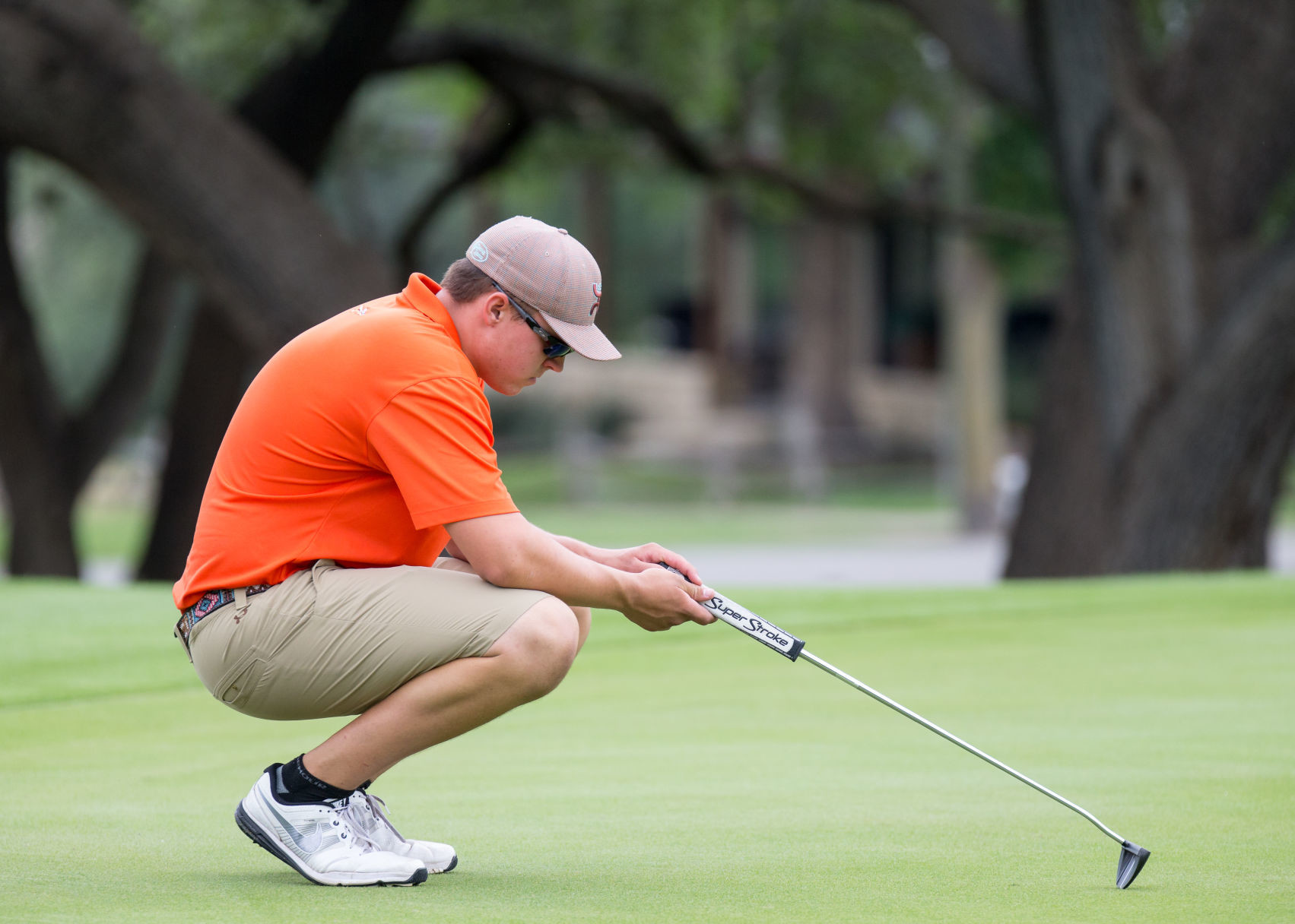 Gonzales High School's Jake Barnick ponders a putt on the No. 10 green during the opening round of the Class 4A boys state golf tournament at Apple Rock Golf Course in Horseshoe Bay, Texas, on Monday, May 22, 2017.