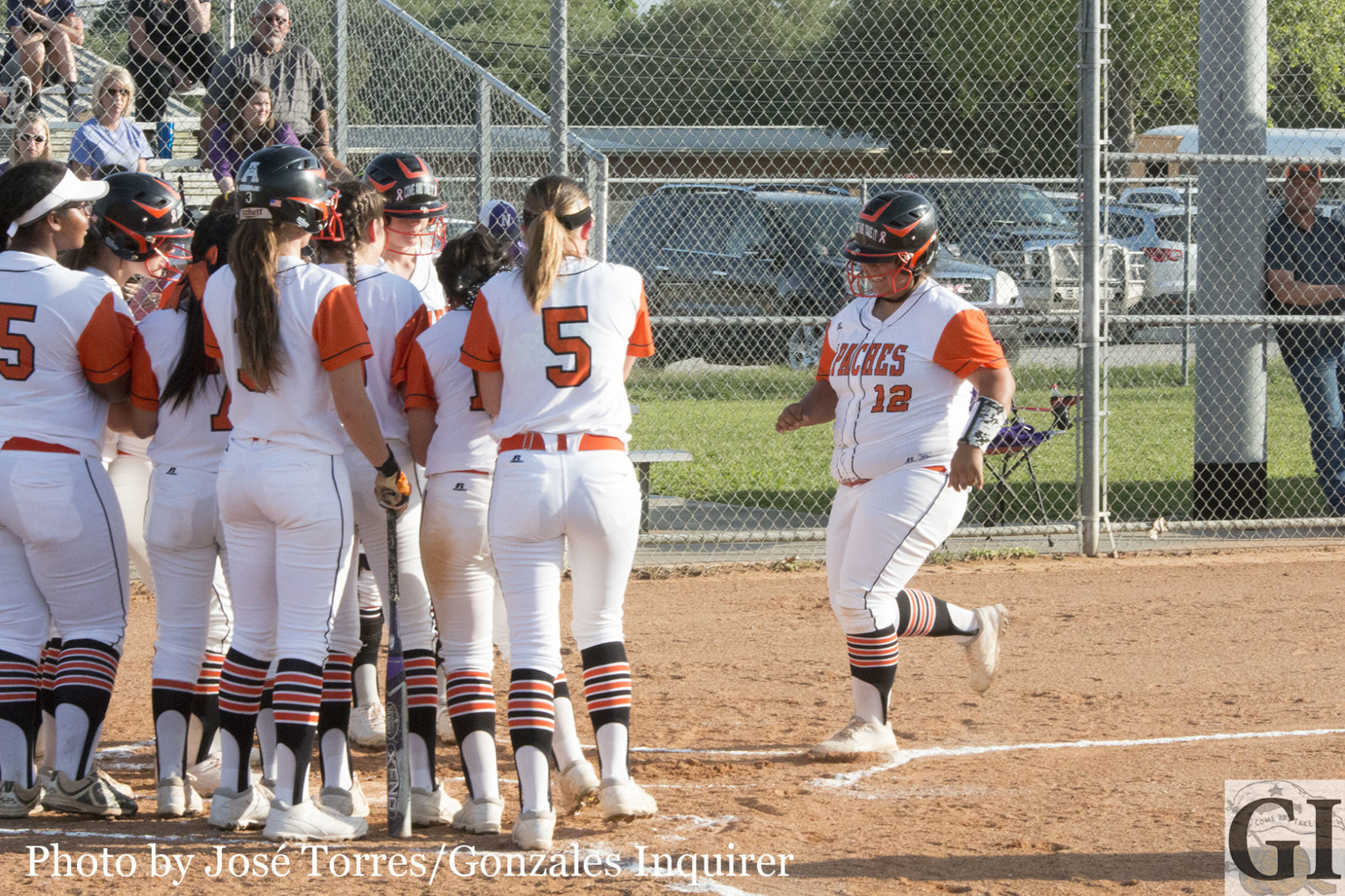 Karina Vara (12) celebrates her grand slam with her teammates in Gonzales’ 5-1 win over Navarro. Vara finished the night going 2-for-2 with four RBIs and a walk.