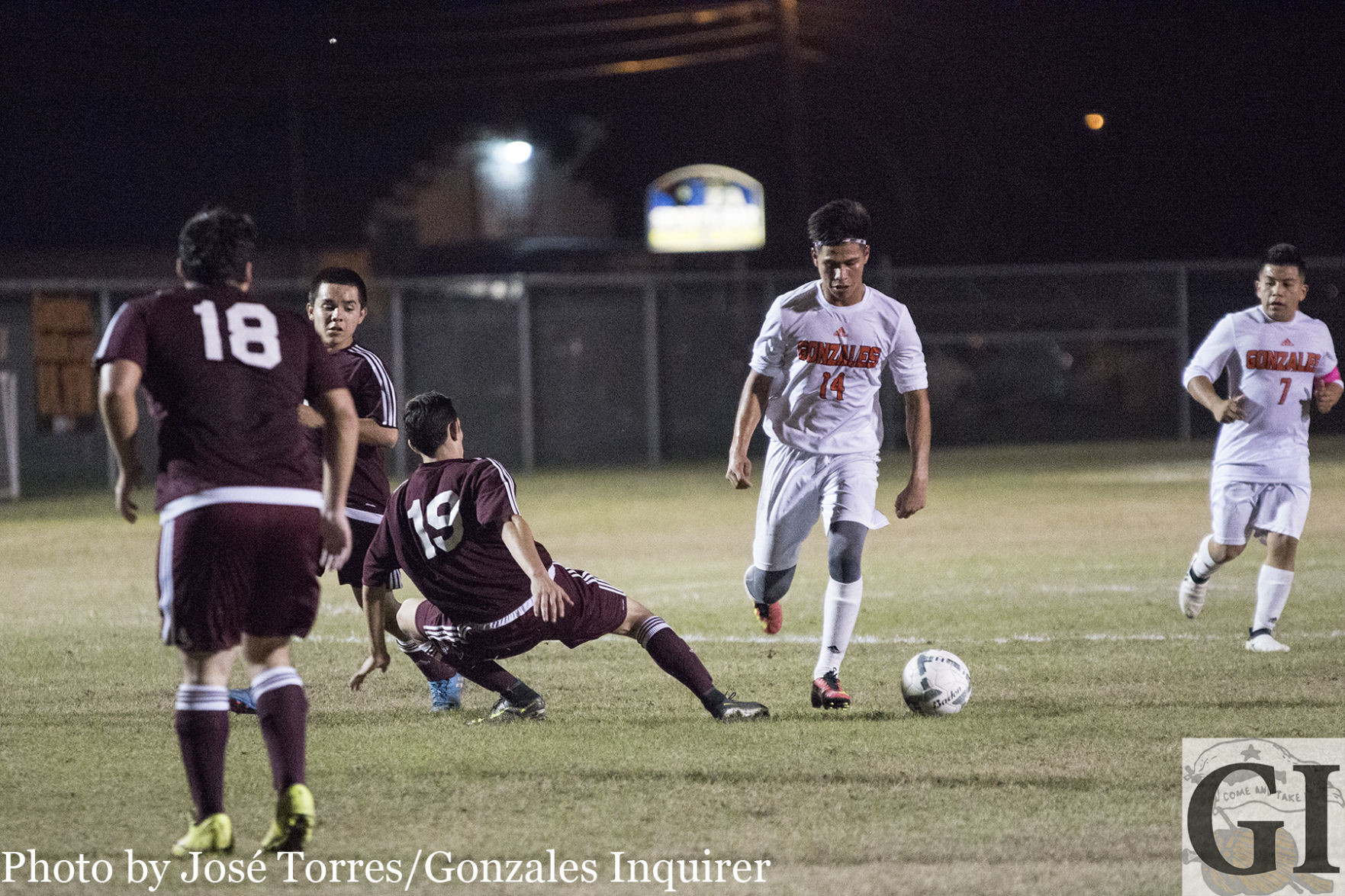 Rogelio Sanchez (14) dribbles down into the box in Gonzales’ 9-1 victory over Floresville. Sanchez came away with a goal.