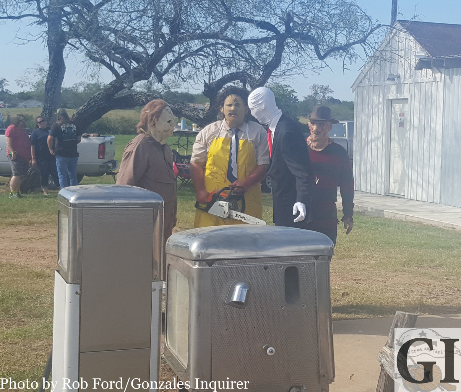 From left, movie villains Michael Myers, Leatherface, Slender Man and Freddy Krueger take time to “cut up” during Saturday’s grand opening of the “WE Slaughter” barbecue joint in Bastrop.