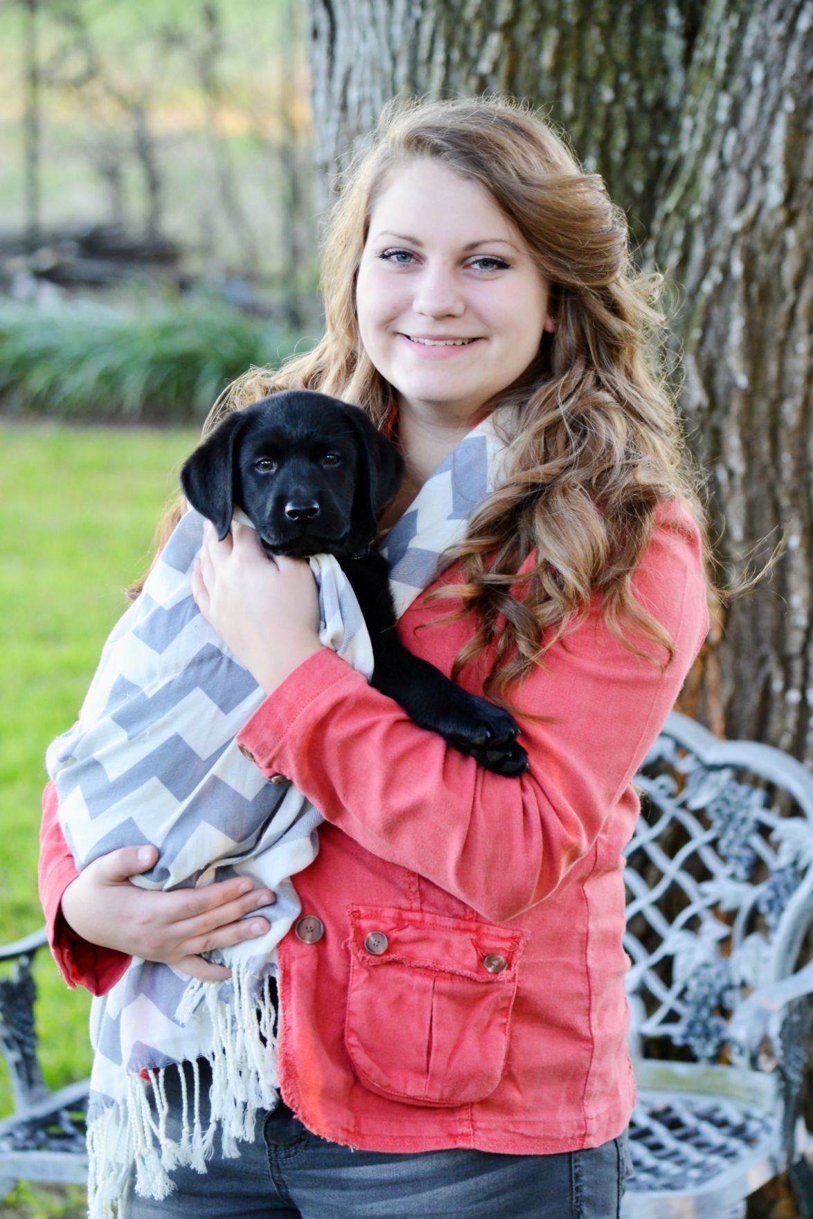 Abbie Dolezal has a new friend in “Shado,” a black labrador puppy who is in training to become her diabetic alert dog.