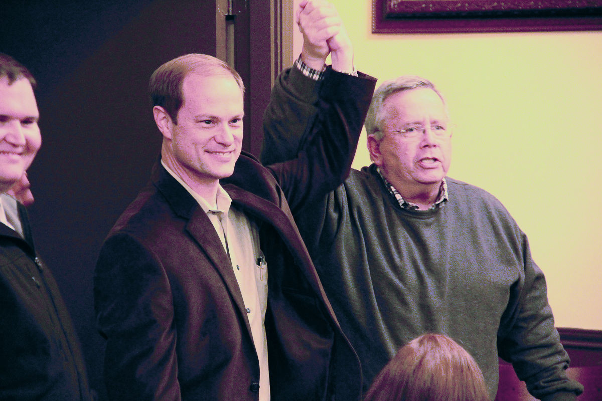 John Cyrier gets his hand raised in victory by Lockhart Mayor Lew White Tuesday night as the final vote tally was announced in the race for state representative. Cyrier gathered 52.06 percent of the five-county vote compared to his opponent, Brent Golemon, who received 47.93 percent. Cyrier will now head to Austin where he will be a part of the 84th Texas Legislature. Cyrier’s acceptance speech can be seen by visiting youtube.com/GonzalesInquirerTV.