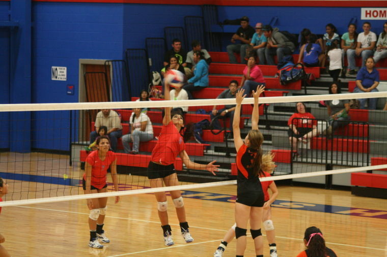The Lady Mustangs hosted Parents’ Night last Tuesday and played spoiler to Karnes City’s playoff chances. Many Nixon-Smiley players registered kills this game, including #8 Miranda Carrillo who is shown attempting an attack while #7 Savannah Martinez watched on.